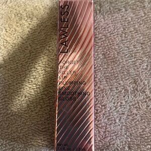 LAWLESS Lip Plumping Gloss in Pink and Gold